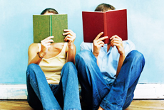 Two people reading books