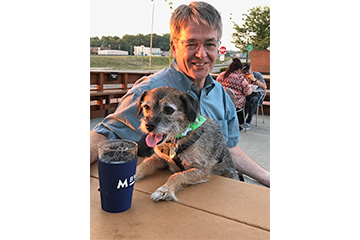 Hamilton Caster Employee Joe Ford with his dog Boonie